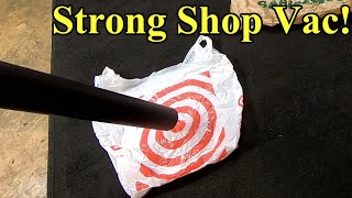 6 horsepower Shop Vac vacuuming up big bags