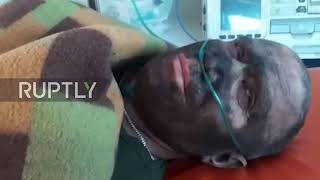 Russia: Rescuer speaks from ambulance after surviving Siberian mine accident