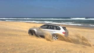 Bmw E70 x5 driving on sand with thin spare wheel