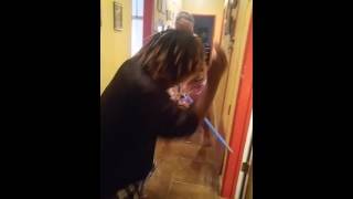 Mom beats son with broom