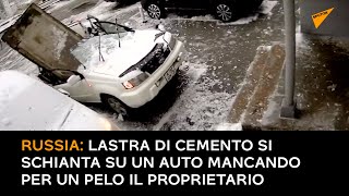 Russia: lastra di cemento si schianta su un auto mancando per un pelo il proprietario