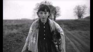Girl walking with her dead cat - Sátántangó - Bela Tarr - 1994
