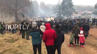 Belarus: Migrants gather for distribution of provisions at border with Poland