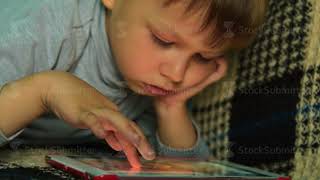 Child spending leisure time with tablet PC