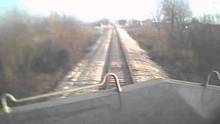 Train hits dump truck, locomotive cab video