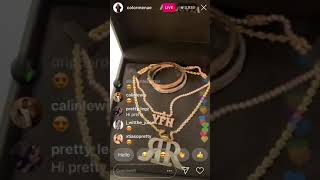 Reginae carter in good Christmas spirits shows Christmas decorations and ice box jewelry