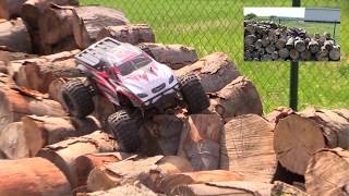 Affordable And Cheap RC CAR - ZD Racing 1:10 Big Foot On The pile of wood and car.