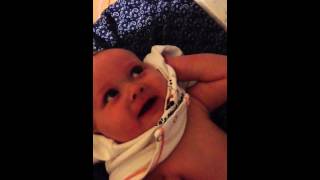 Mom tickling baby