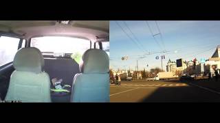 Гайцы силой заталкивают девушку в машину.