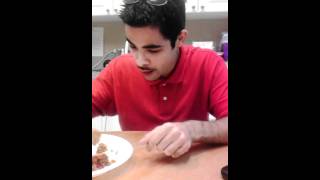 Luis trying two ghost pepper sauces at once