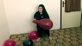 Girl sit to pop balloons