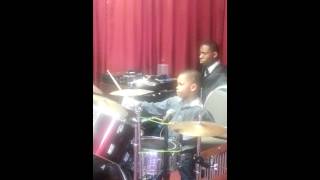 Drumming like a pro. Passing on the stix to the ne