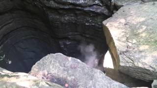 Huge rock being thrown down GIANT hole