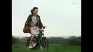 Woman pedal starting and riding her moped (from Tatort)
