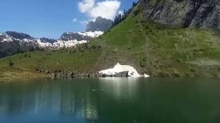 Alphorn Spieler Player Oberblegisee Braunwald Schweiz Switzerland