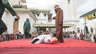Muslim woman is caned 23 times in Indonesia for 'standing too close to her boyfriend'