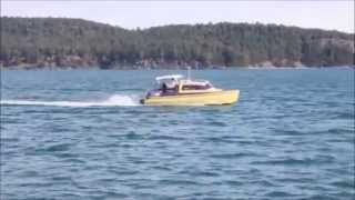 Skoota 28 power cat escorting a ferry