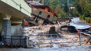 Rushing streams of water and mud carry away cars and people! Colombia is raging severe flooding!