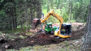 John Deere 1270D and komatsu pc 78 us in forest