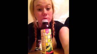 Typical teenage girl licking a bottle.