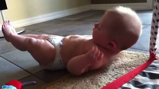 Baby Pilates - Infant doing double leg stretch; great form