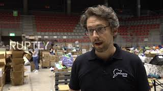 Germany: Dozens of volunteers help sort aid for flood victims in Nurburg