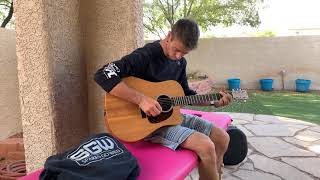 Taking a break from work to play my guitar and sing.