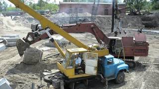 Old russian excavator EO-5124 playin" wit" big concrete cube