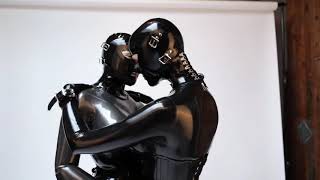 Latex girls cuddling.