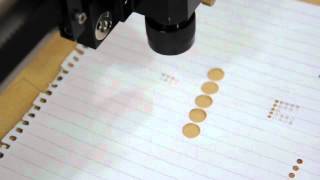Cutting 2mm holes on paper by the new XLE XY stages for DIY CO2 laser
