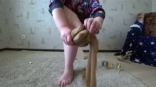 legs of a mature lady in nylon pantyhose