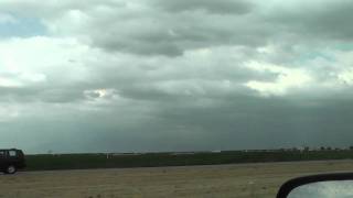 Crop dusting plane flying low over I-5