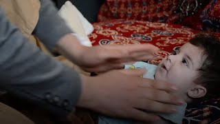 Afghan family cares for child separated from parents during Kabul evacuations