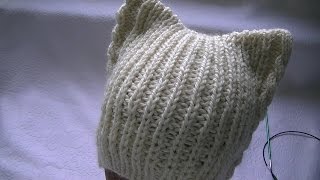 Hand-knitting of a hat with cat's ears.