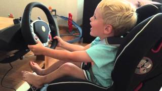 Kid Racing Playstation Dirt With Real Ferrari Steering Wheel
