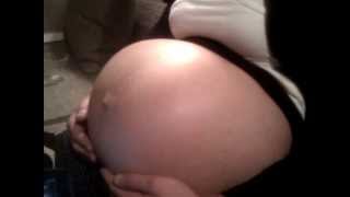 Twins are kicking inside the belly