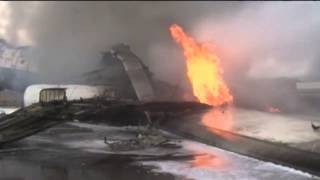 Watch: Plane burns on airport runway after air strike
