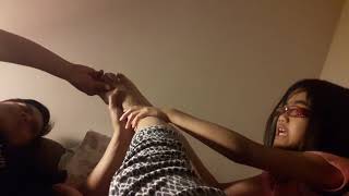 Daughter and dad give tired mom a good foot massage