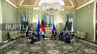 Russia: Merkel's phone rings during meeting with Putin