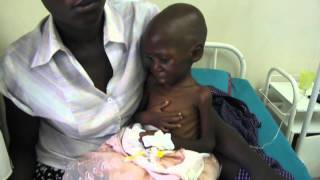 Africa. HIV positive mother and child,Африка. ВИЧ позитивные мама и ребёнок.
