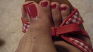 Red Toenails Playing With Red Heels