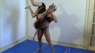 Strong woman wrestle and lift little man