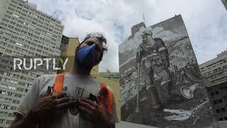Brazil: Artist creates mural with ashes from Amazon fires