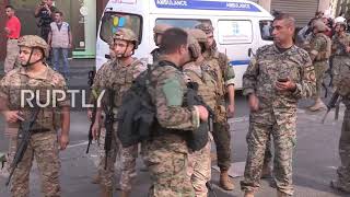 Lebanon: Rescue workers evacuate residents from burning buildings amid Beirut gunfire