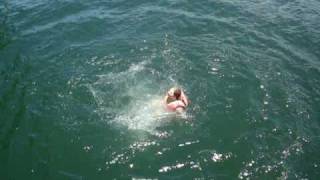 Screaming cliff diving girl with wedgie