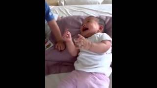 axel tickle his baby sister