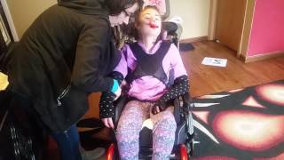 Strapping Bella into wheelchair without TLSO