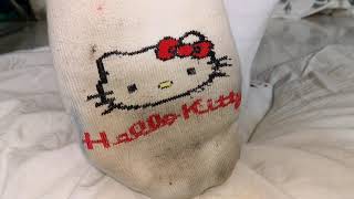 Dirty kitty socks trample on pillow
