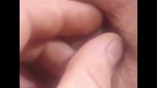 Friend picking belly button lint