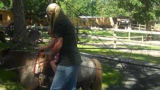 Elodie riding a pony